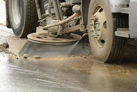 image of a street sweeping machine in operation