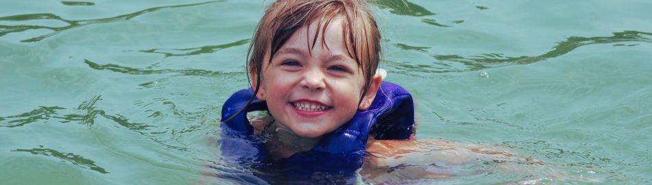 image of child in water with lifejacket