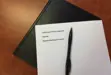 image of agenda on desk with pen 