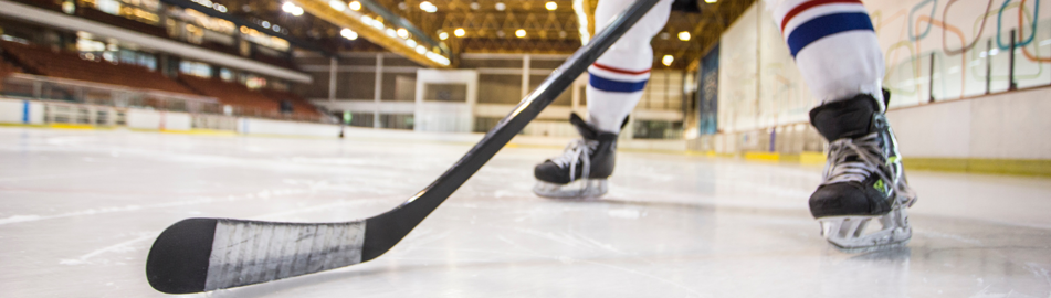 image of hockey skates and stick